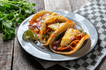 Mexican food: Authentic tacos al pastor with lime and pineapple