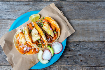 Mexican food: Authentic tacos al pastor with lime and pineapple