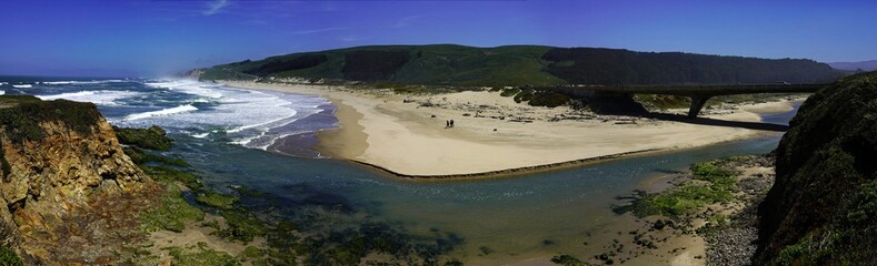 Panoramic view of coastline scenery of blue sky with rocks and beach on Pacific Coast, California