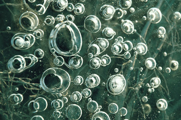 Texture abstract closeup background ice with bubbles of air caught by frost in the mass of water...