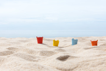 toys put on the white sand beach