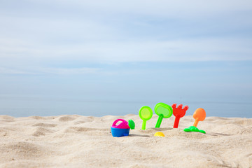 Fototapeta na wymiar toys put on the white sand beach