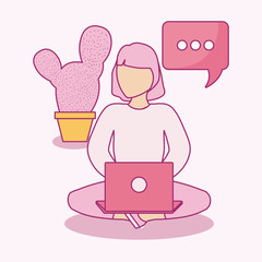 woman seated using laptop with speech bubble
