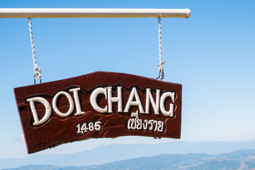 The wooden sign pole on the view point of Doi Chang village tell the high altitude of 1,485 metres...