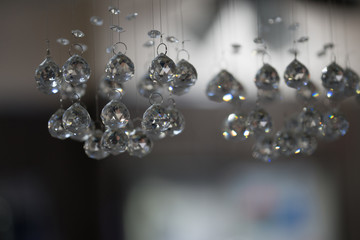 Image of a crystal chandelier blurry bokeh background