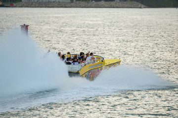 Thriller Miami speedboat with tourists excited for speed