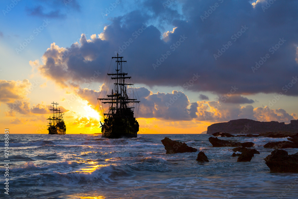 Wall mural old ship silhouette in sunset scenery