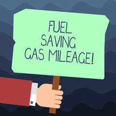 Text sign showing Fuel Saving Gas Mileage. Conceptual photo Expending less money in vehicle expenses gas savings Hu analysis Hand Holding Blank Colored Placard with Stick photo Text Space