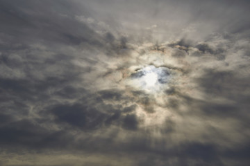the spring sun through the clouds