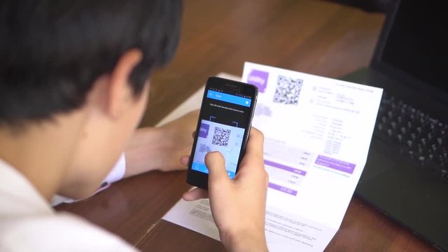 Electricity and Gas Bill. Payment of utilities using QR code and mobile device. QR Code Scanner and Mobile Payment System. Scanning and Paying on smartphone