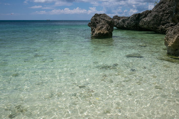 A seascape with rocks on a sunny day