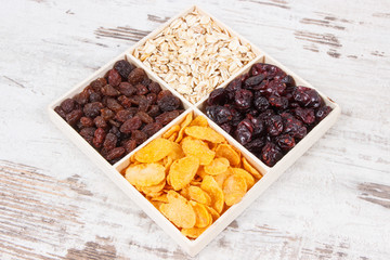 Healthy nutritious dried fruits with flakes as source vitamins, carbohydrates and dietary fiber