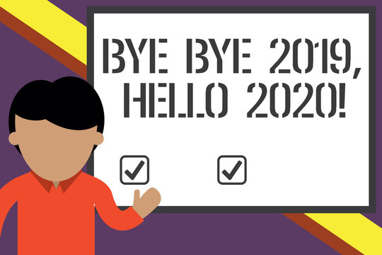 Writing note showing Bye Bye 2019 Hello 2020. Business concept for saying goodbye to last year and welcoming another good one Young man standing in front whiteboard pointing to project. photo Art