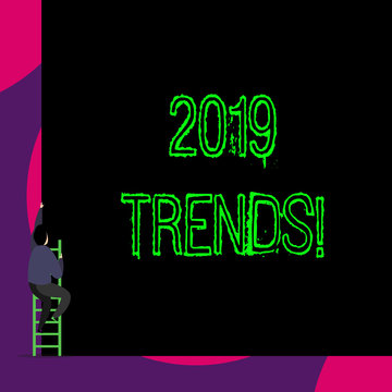Handwriting text 2019 Trends. Conceptual photo general direction in which something is developing or changing Back view young man climbing up staircase ladder lying big blank rectangle