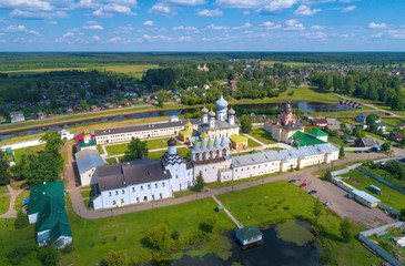 The Tikhvin Bogorodichny Uspensky monastery in a summer landscape (aerial photography). Tikhvin, Russia