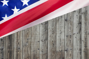 rippled usa flag on wooden background for forth of july american independence day concept