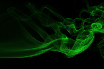 Green smoke on black background and darkness concept