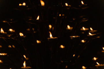 Candles light in darkness
