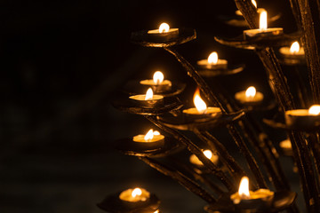 Candles light in darkness