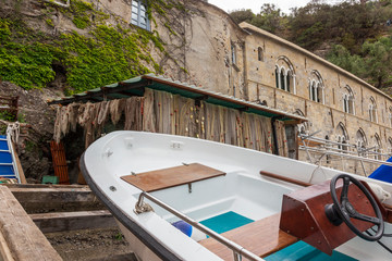 Obraz na płótnie Canvas San Fruttoso, Italy. 04-29-2019. Boat on the beach at San Fruttoso monastery, Italy