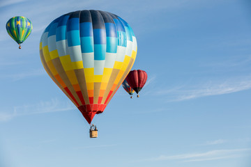 Multi colored hot air balloons on blue sky