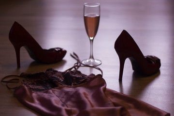 sexy lingerie, high heels and a glass of wine