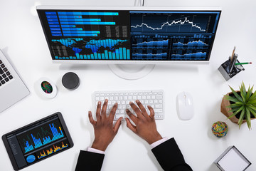 Businesswoman Analyzing Graph On Computer