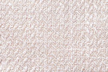 Pink vintage fabric with woven texture closeup. White textile macro background