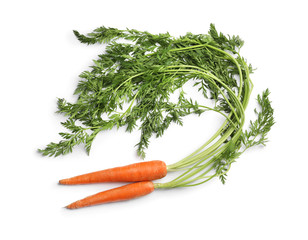 Fresh ripe carrots on white background, top view
