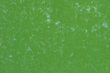 Macro image of worn green ink on paper