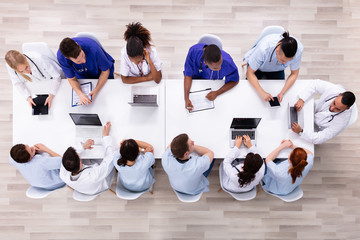 Young Specialists With Stethoscope Having Discussion