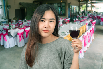 Woman feel happy with wine glass in hand.