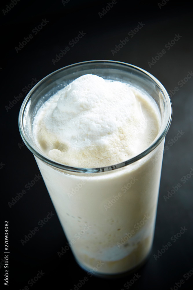 Poster Vanilla shake in glass background 