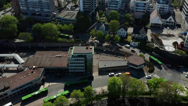 Stavanger Sentrum Norway Panorama Tilt Up Aerial With Traffic Around Park Crossroads Cars Buildings and Cityscape on Sunny Day 4k