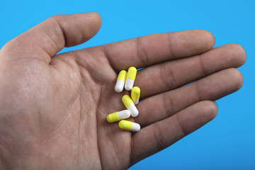 many medicinal pills in the male hand