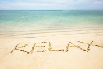 Relax Word Written On The Sand At Beach