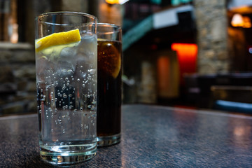 Glasses of tonic and cola on a irish pub.
