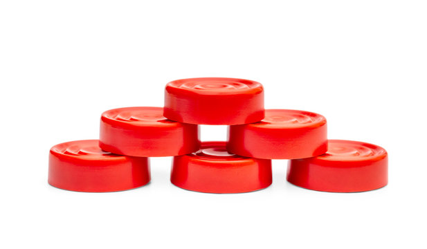 Heap of red checkers on white.