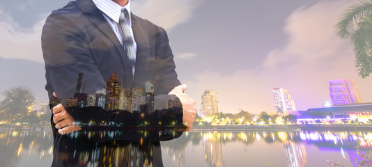 Double exposure of midnight city and business man