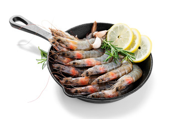Raw  fresh  prawns (shrimps) with lemon and fresh herbs isolated on white background.