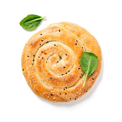 Baked spinach and ricotta pie isolated on white background.