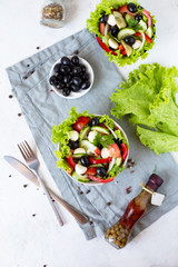 Appetizing greek salad in a plate on a served table