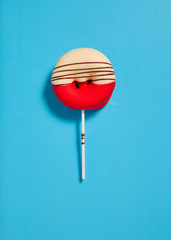 one donut on blue background