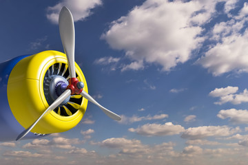 Motor airplane with a propeller against the blue sky with clouds