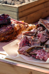 wild boar meat boar dark delicious exotic cooked on a fire on a wooden background