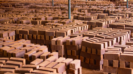 a pile of bricks at a brick factory in the south of india