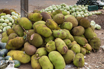a pile of jackfruit on an indian market near the roadside in the south of india