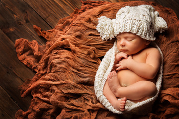 Sleeping Newborn Baby, New Born Kid sleep in Hat, Studio Portrait on Brown Background, Child one...
