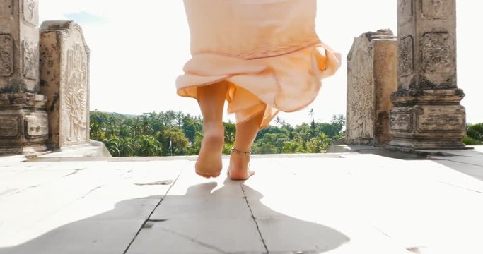 Beautiful caucasian girl visiting the water palace in Bali