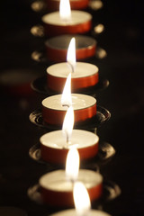 Burning small candles - religion concept
